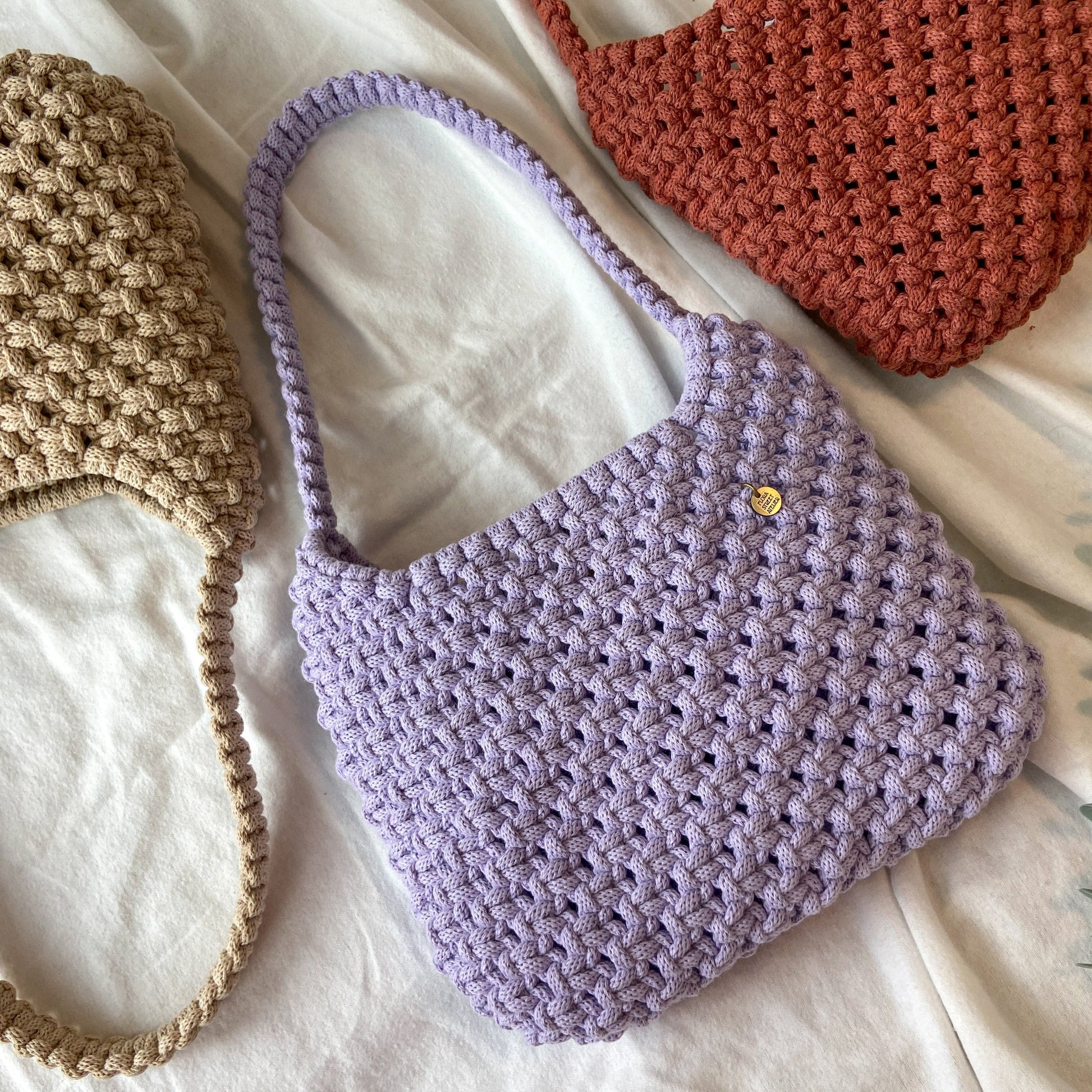 Neutral tone handwoven macrame hobo shoulder bag with recycled cotton rope and minimalist design
