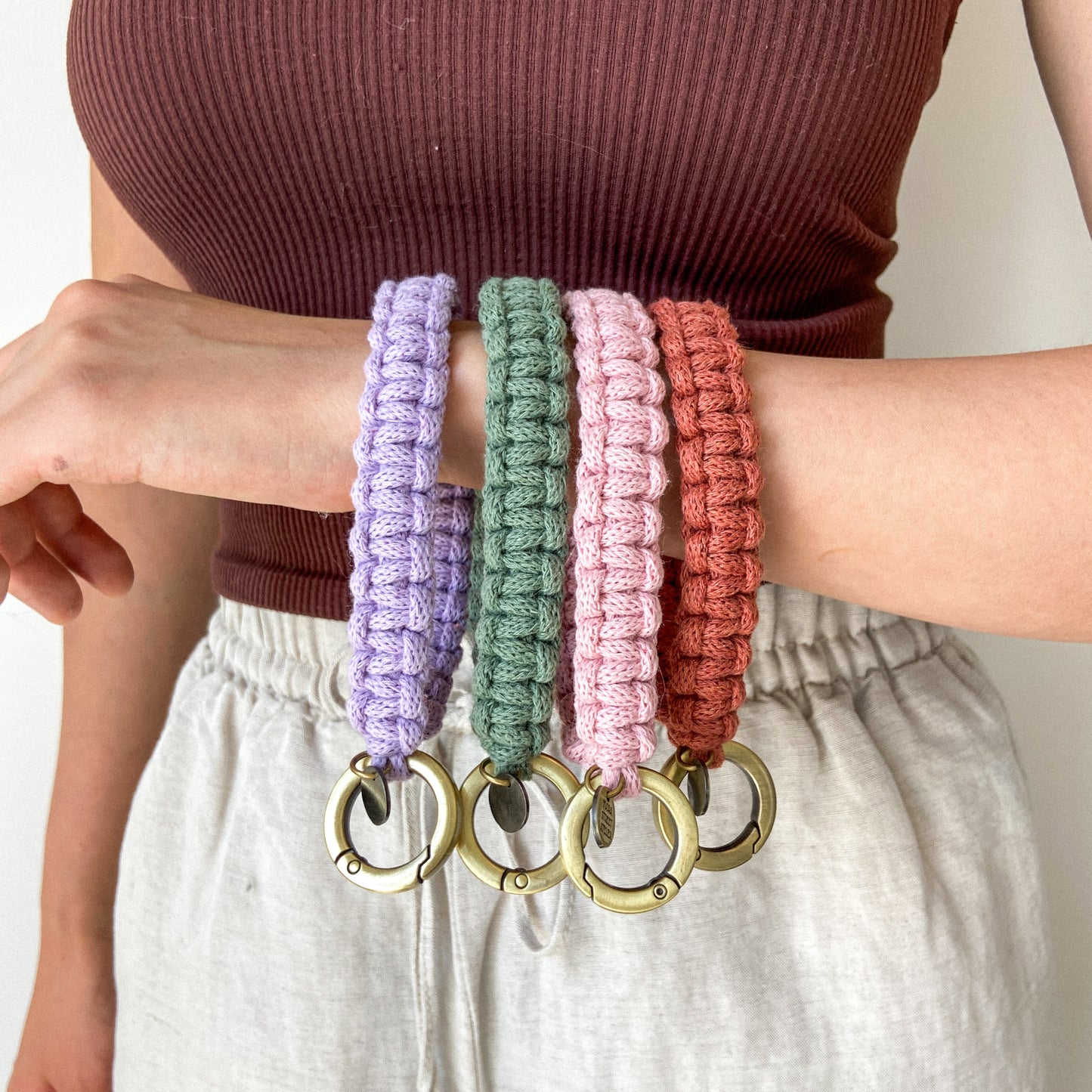 Hand knotted macrame wristlet strap with metal clasp, handmade by Flora Street Atelier, crafted in Canada with recycled cotton
